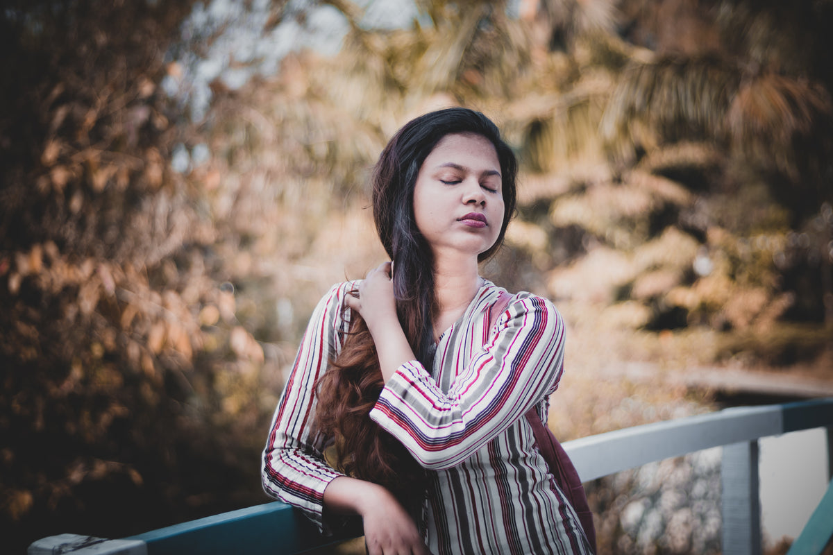 a-woman-taking-in-the-sound-of-nature
