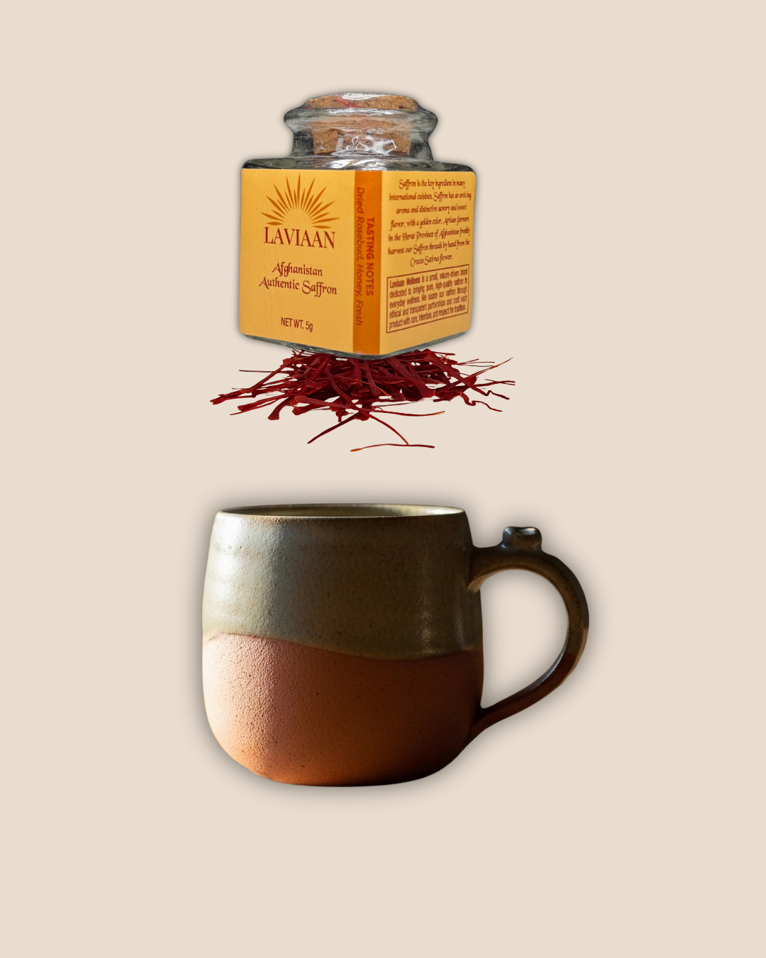 Jar of saffron, saffron strands, and a ceramic mug on a beige background